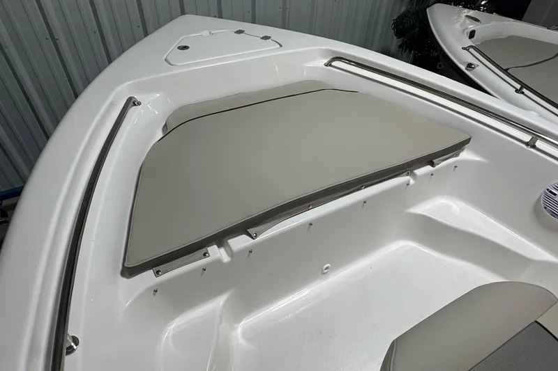 Slide: The Image of 2026 Key West 189 FS boat interior with cushioned seating and stainless steel railings. - 7