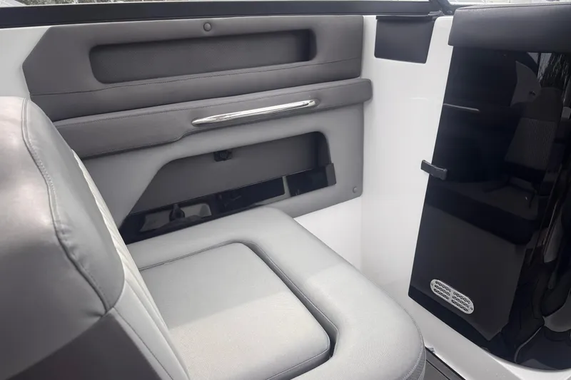 Slide: The Image of Interior of 2020 Rinker Q3 OB boat, featuring sleek seating and modern design elements. - 13