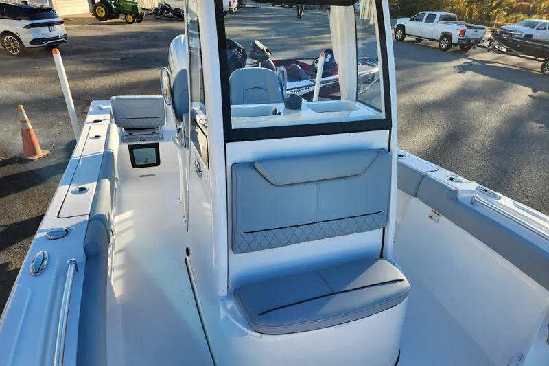 Slide: The Image of 2026 Sportsman Heritage 231 Center Console boat interior with seating and console view. - 13