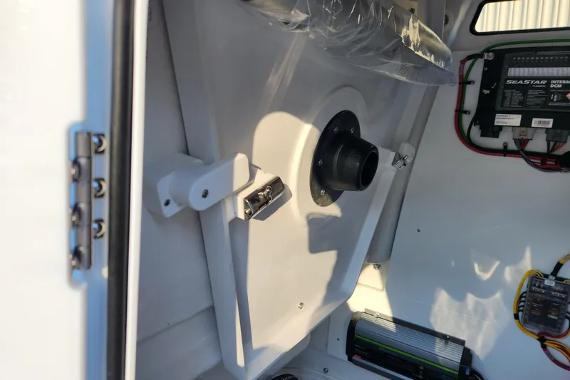 Slide: The Image of Interior view of 2026 Sportsman Heritage 231 Center Console boat, showcasing electrical components. - 18