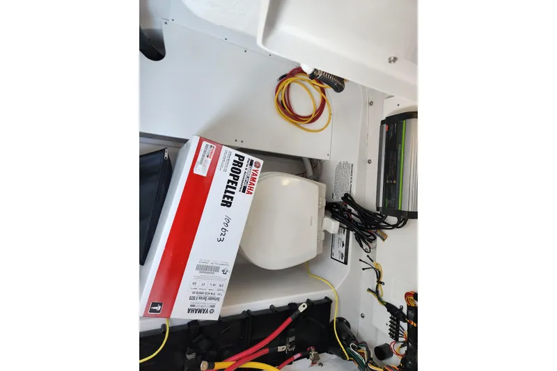 Slide: The Image of 2026 Sportsman Heritage 231 Center Console interior with Yamaha propeller box and wiring. - 19