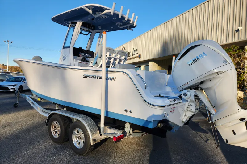 Slide: The Image of 2026 Sportsman Heritage 231 Center Console boat on trailer, featuring Yamaha outboard motor. - 2