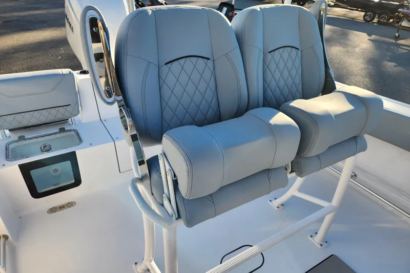 Slide: The Image of 2026 Sportsman Heritage 231 Center Console boat with luxurious dual seating and modern design. - 22