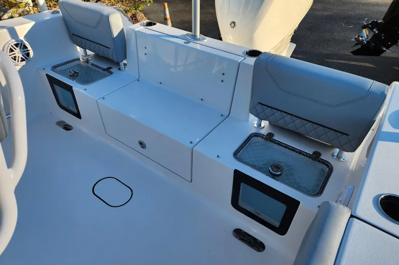 Slide: The Image of 2026 Sportsman Heritage 231 Center Console boat interior with seating and storage compartments. - 23