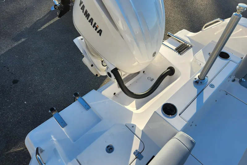 Slide: The Image of 2026 Sportsman Heritage 231 Center Console boat with Yamaha outboard motor, rear deck view. - 24