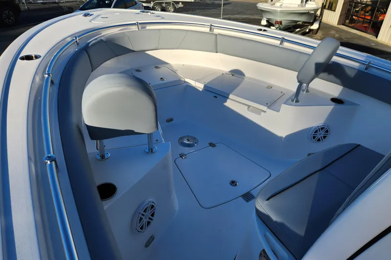 Slide: The Image of 2026 Sportsman Heritage 231 Center Console boat interior with seating and storage compartments. - 8