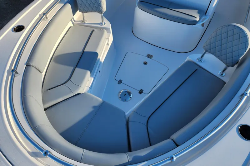 Slide: The Image of 2026 Sportsman Heritage 231 Center Console boat interior with cushioned seating. - 9