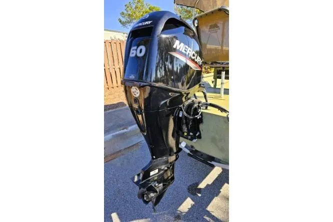 Slide: The Image of 2021 Lowe Roughneck 1860CC boat with camo seating and Mercury outboard motor. - 4