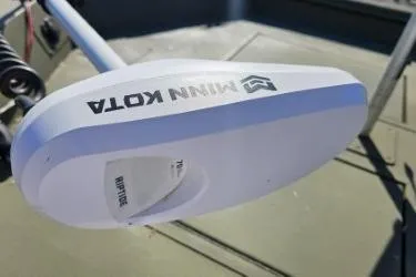 Slide: The Image of 2021 Lowe Roughneck 1860CC with Mercury 60 outboard motor, parked outdoors. - 5