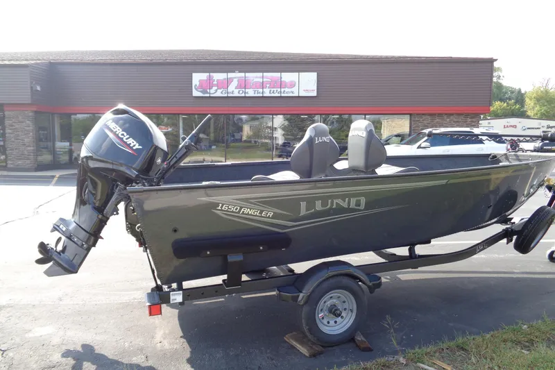 Slide: The Image of 2026 Lund 1650 Angler Tiller boat with Mercury engine on trailer. - 7