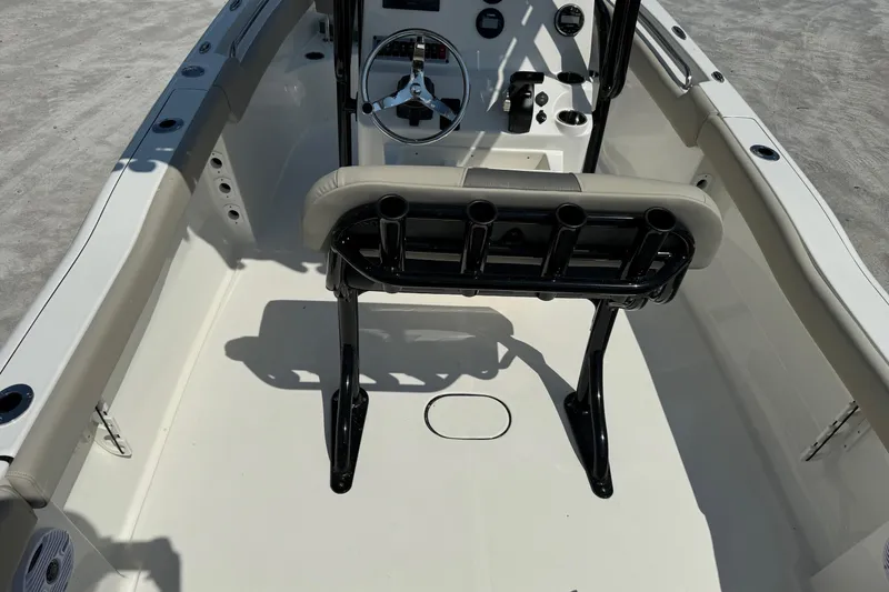 Slide: The Image of 2025 Key West 203 FS boat interior with steering wheel and seating. - 5