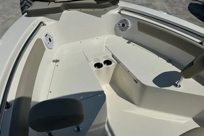 Slide: The Image of 2025 Key West 203 FS boat interior with seating and cup holders. - 9