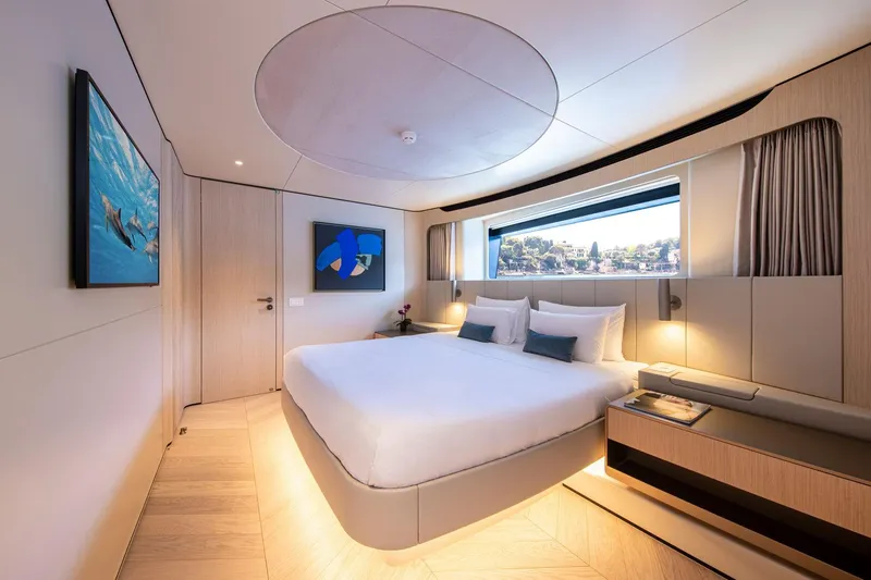 Slide: The Image of Luxurious bedroom in 2021 Van der Valk Custom 34M Explorer yacht, featuring modern design and large window. - 20
