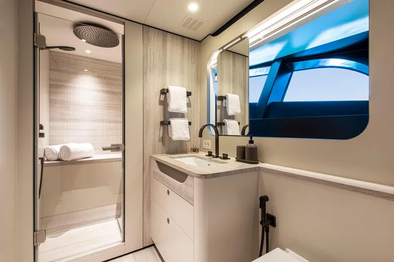 Slide: The Image of Luxurious bathroom in 2021 Van der Valk Custom 34M Explorer yacht, featuring modern fixtures and elegant design. - 21