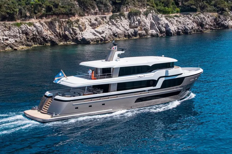 Slide: The Image of Luxurious 2021 Van der Valk Custom 34M Explorer yacht cruising in clear blue waters. - 3