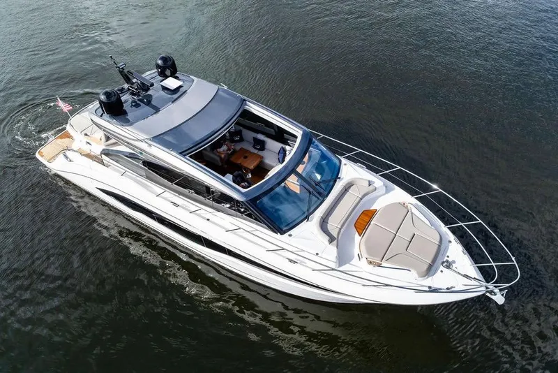 Slide: The Image of 2021 Princess V55 yacht cruising on calm waters, aerial view. - 12