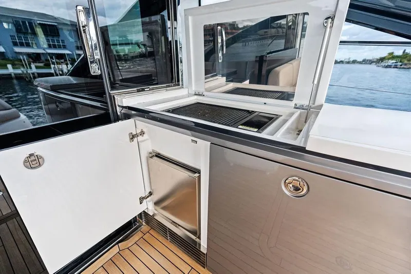 Slide: The Image of Outdoor kitchen on 2021 Princess V55 yacht with grill and storage. - 18
