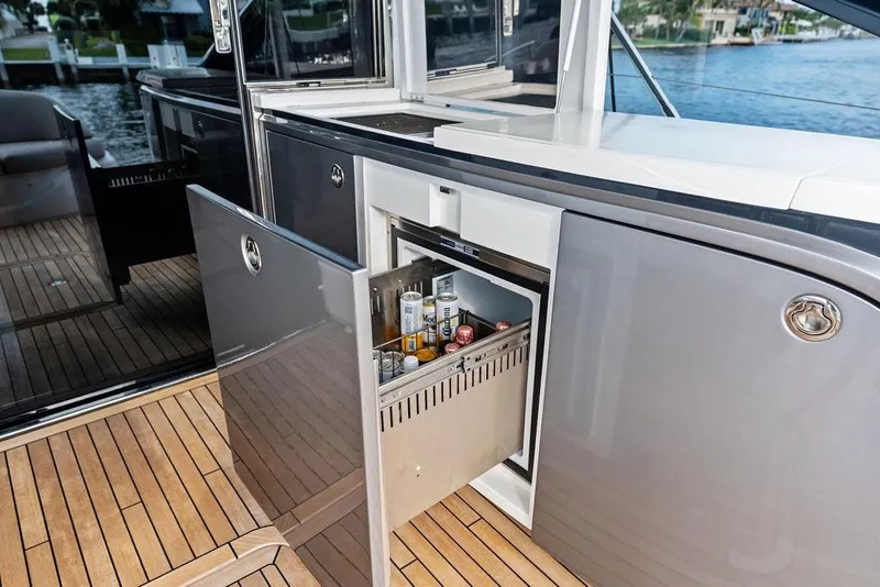 Slide: The Image of Luxury yacht Princess V55 2021 with open mini fridge on deck. - 19