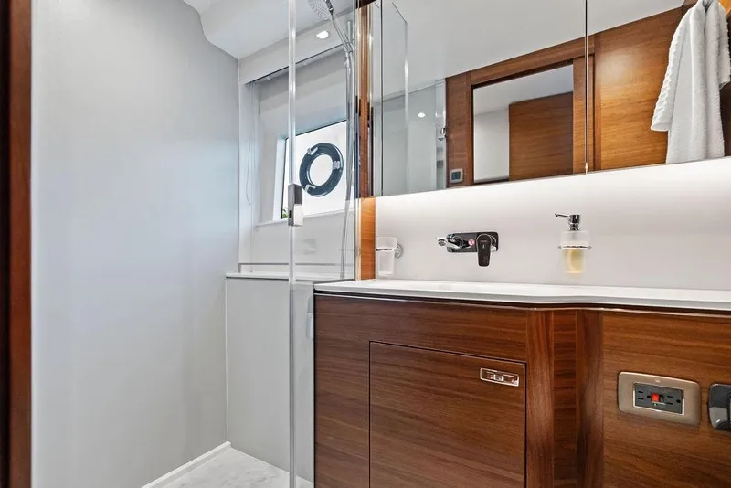 Slide: The Image of Luxurious bathroom interior of 2021 Princess V55 yacht with modern wood finishes. - 39