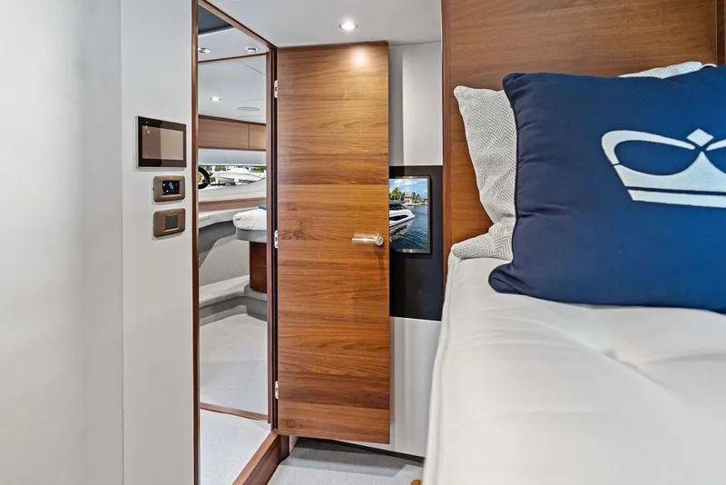 Slide: The Image of Interior of 2021 Princess V55 yacht with modern wood finish and cozy bedding. - 44