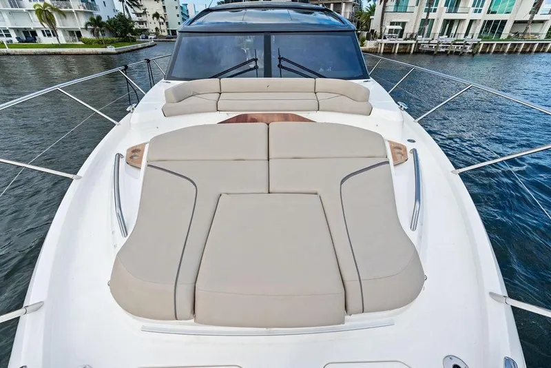 Slide: The Image of 2021 Princess V55 yacht with spacious sunbathing deck on calm waters. - 50