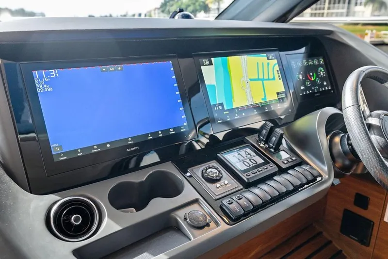 Slide: The Image of Cockpit of 2021 Princess V55 yacht with advanced navigation displays and controls. - 52