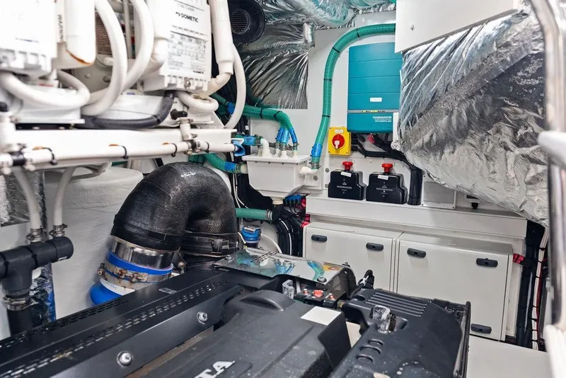 Slide: The Image of Engine room of 2021 Princess V55 yacht, showcasing mechanical components and systems. - 64