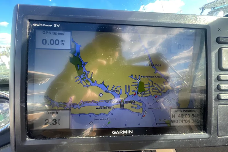 Slide: The Image of Garmin GPS display on 2014 Sea Ray 240 Sundeck Outboard, showing navigation map and speed. - 20
