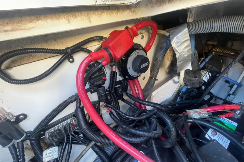 Slide: The Image of Electrical wiring and components inside a 2014 Sea Ray 240 Sundeck Outboard boat. - 28