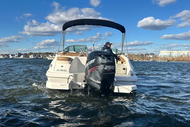 Slide: The Image of 2014 Sea Ray 240 Sundeck Outboard on water, featuring Mercury 250 Pro engine. - 3