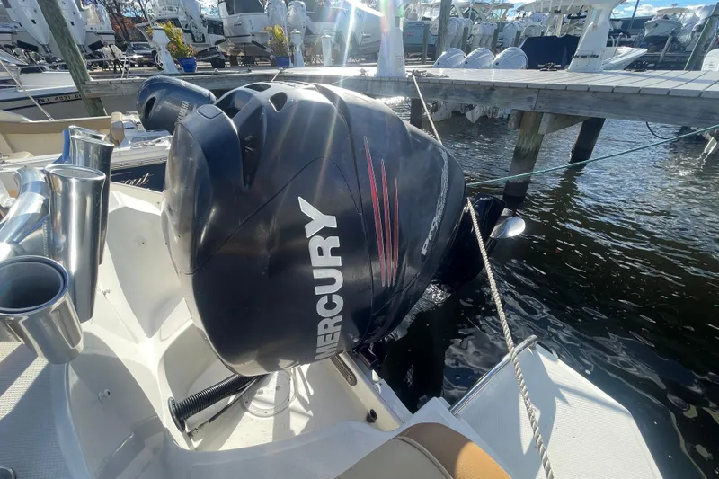 Slide: The Image of 2014 Sea Ray 240 Sundeck Outboard with Mercury engine at marina dock. - 32