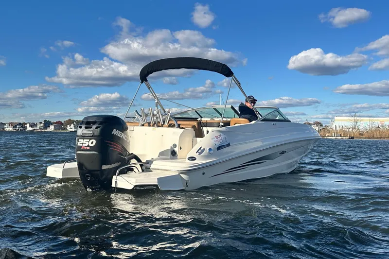 Slide: The Image of 2014 Sea Ray 240 Sundeck Outboard on water, featuring a Mercury 250 Pro engine. - 4