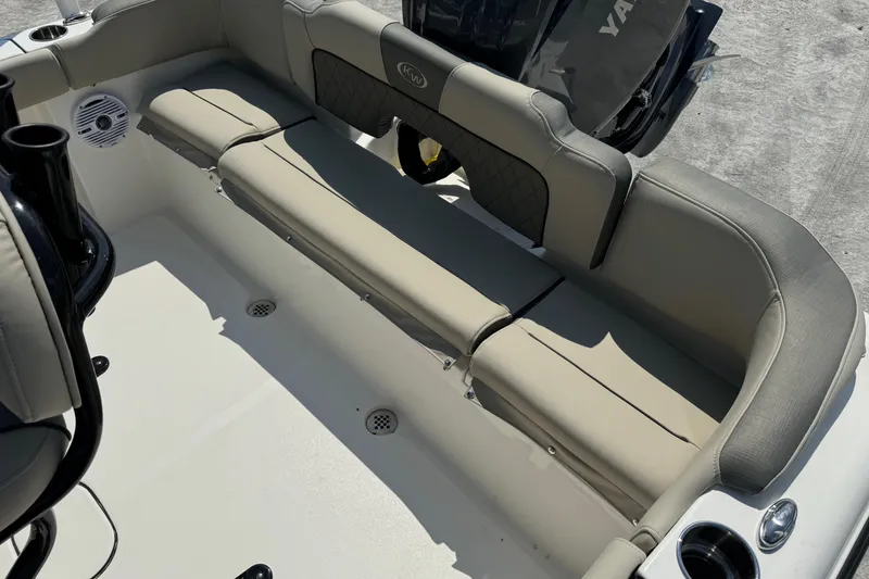 Slide: The Image of 2025 Key West 203 FS boat interior with beige seating and Yamaha engine. - 18