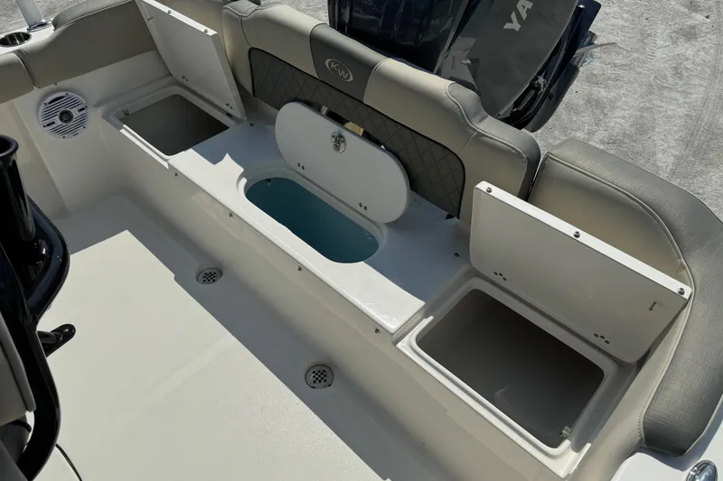 Slide: The Image of 2025 Key West 203 FS boat interior with open storage compartments and seating. - 19