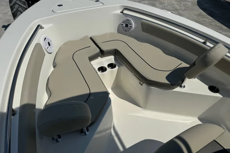 Slide: The Image of 2025 Key West 203 FS boat interior with beige seating and cup holders. - 8