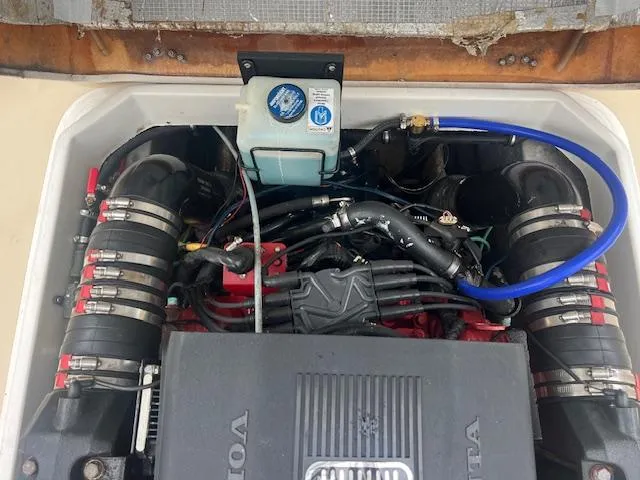 Slide: The Image of Engine compartment of a 2004 Hunt Yachts Surfhunter 25, featuring Volvo Penta components. - 15