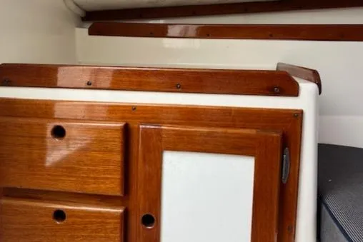 Slide: The Image of 2004 Hunt Yachts Surfhunter 25 interior with polished wood cabinetry. - 14