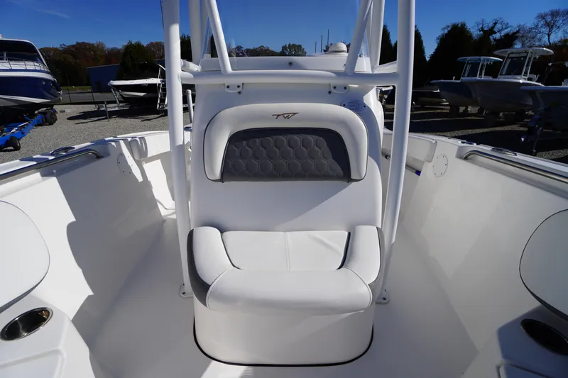 Slide: The Image of 2018 Tidewater 210 LXF boat interior with white seating and sleek design. - 10