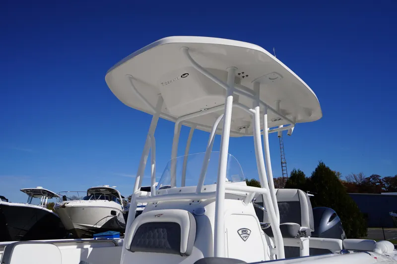 Slide: The Image of 2018 Tidewater 210 LXF boat with T-top against clear blue sky. - 17