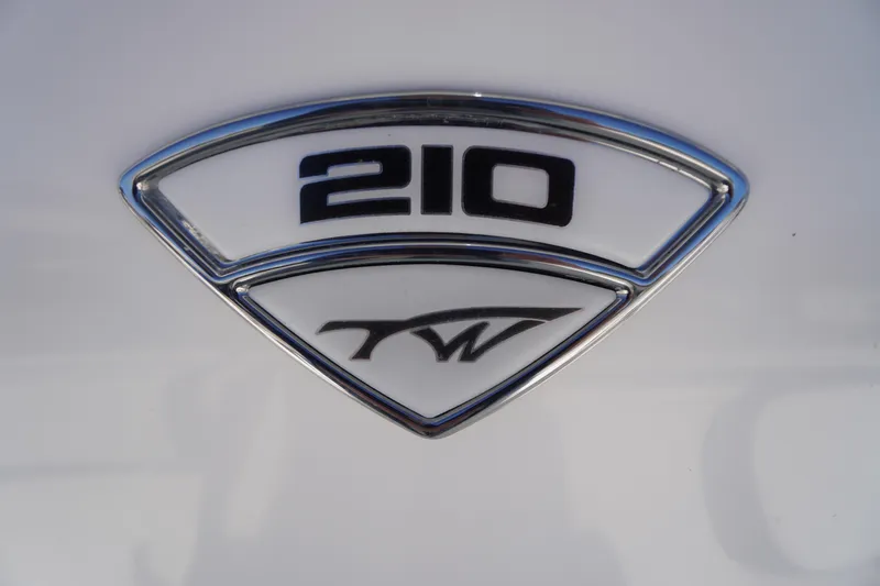 Slide: The Image of Tidewater 210 LXF 2018 model emblem on a white background. - 2