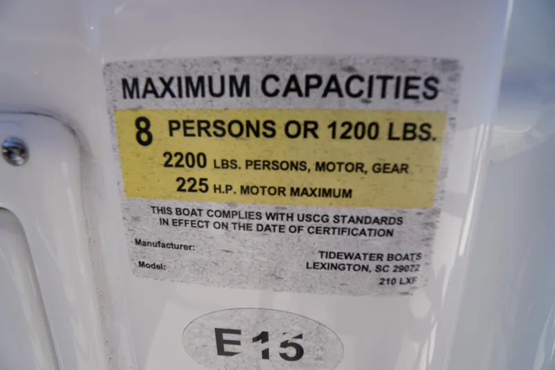 Slide: The Image of 2018 Tidewater 210 LXF capacity label, 8 persons or 1200 lbs, 225 HP motor max. - 24