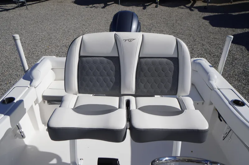 Slide: The Image of 2018 Tidewater 210 LXF boat seating with gray and white upholstery. - 25