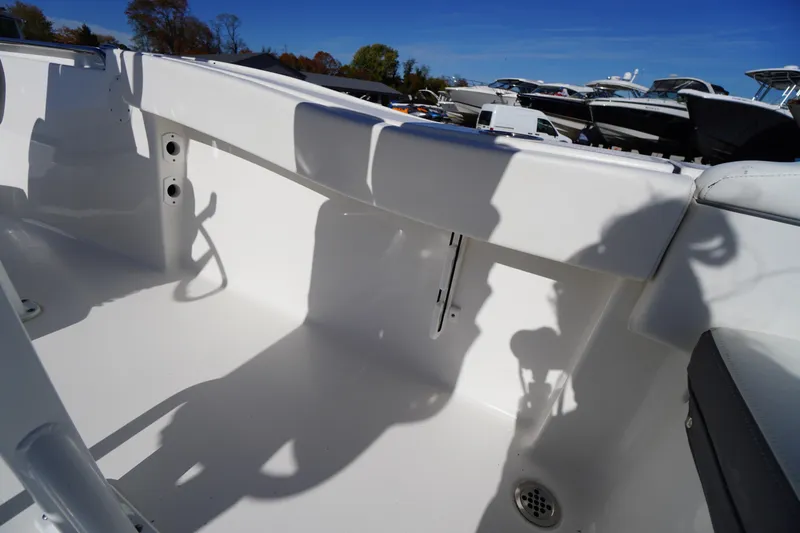 Slide: The Image of 2018 Tidewater 210 LXF boat interior with white seating and shadow details. - 27