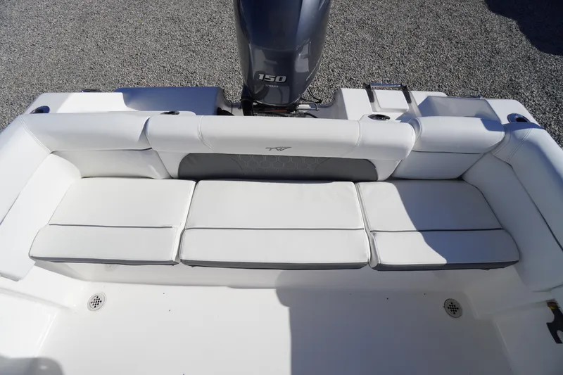 Slide: The Image of 2018 Tidewater 210 LXF boat with white cushioned seating and 150 horsepower engine. - 29