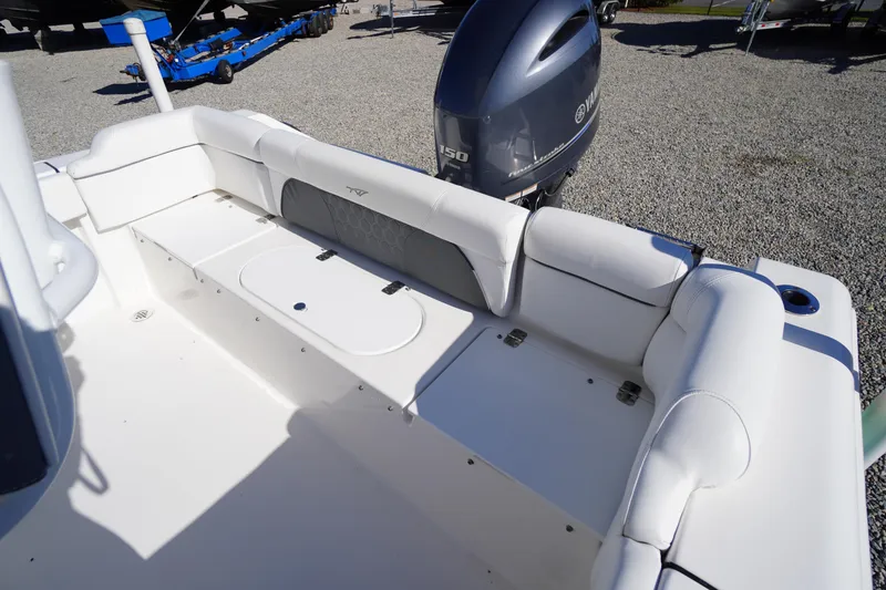 Slide: The Image of 2018 Tidewater 210 LXF boat with Yamaha outboard motor and spacious seating area. - 33