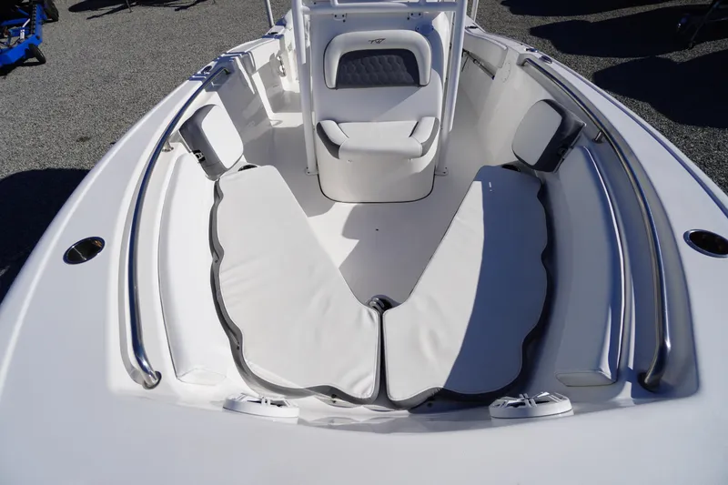 Slide: The Image of 2018 Tidewater 210 LXF boat interior with cushioned seating and stainless steel rails. - 5