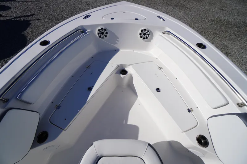 Slide: The Image of 2018 Tidewater 210 LXF boat interior with seating and storage compartments. - 7