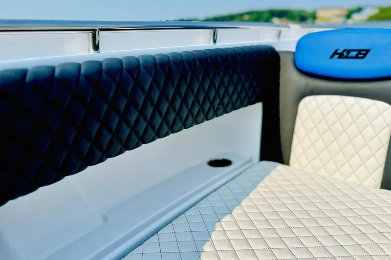 Slide: The Image of Luxurious interior of 2025 HCB 48 Campeon boat with quilted seating. - 10