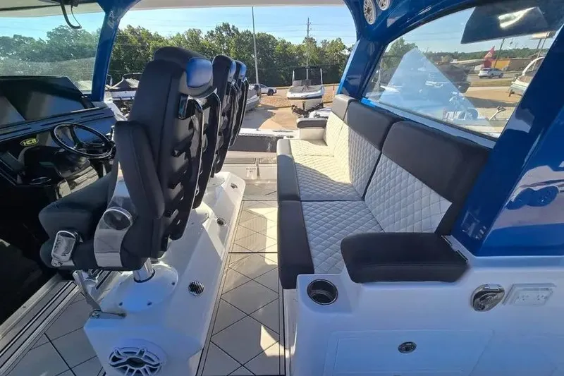 Slide: The Image of Interior of 2025 HCB 48 Campeon boat with luxurious seating and modern design. - 12