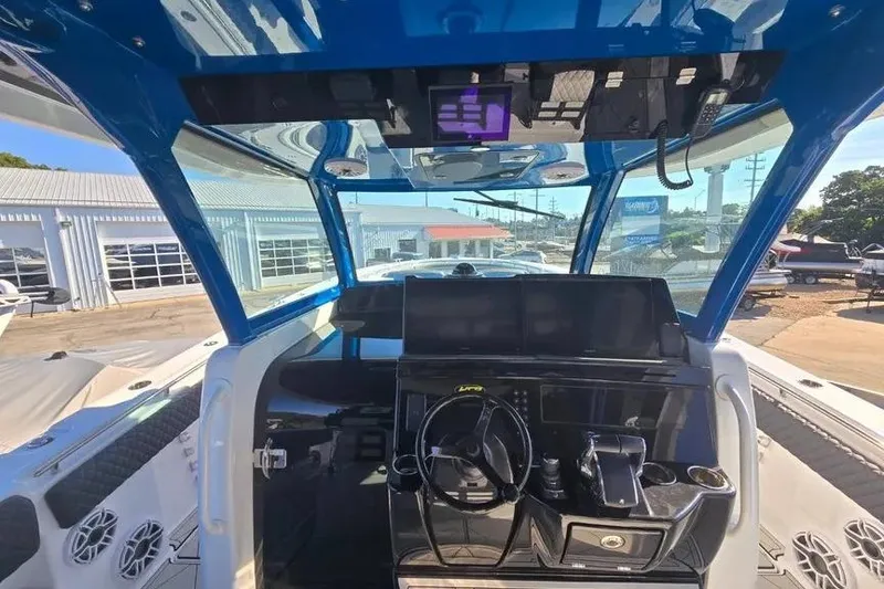 Slide: The Image of 2025 HCB 48 Campeon boat cockpit with modern controls and sleek design. - 13